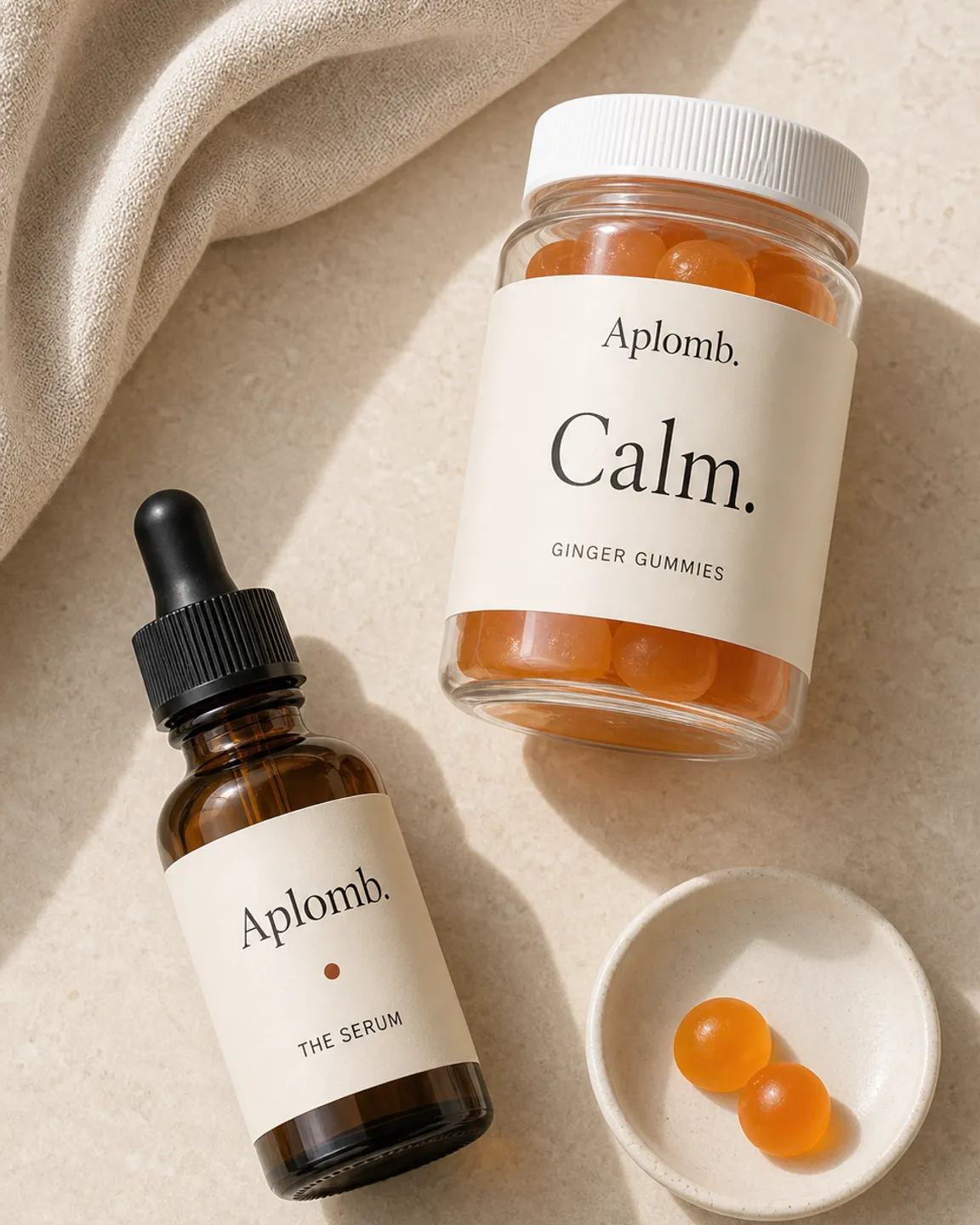The APLOMB Essentials Kit: the Facial Serum and Ginger gummies.